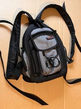 Compact Gray & Black Sling Precision Design Camera Backpack